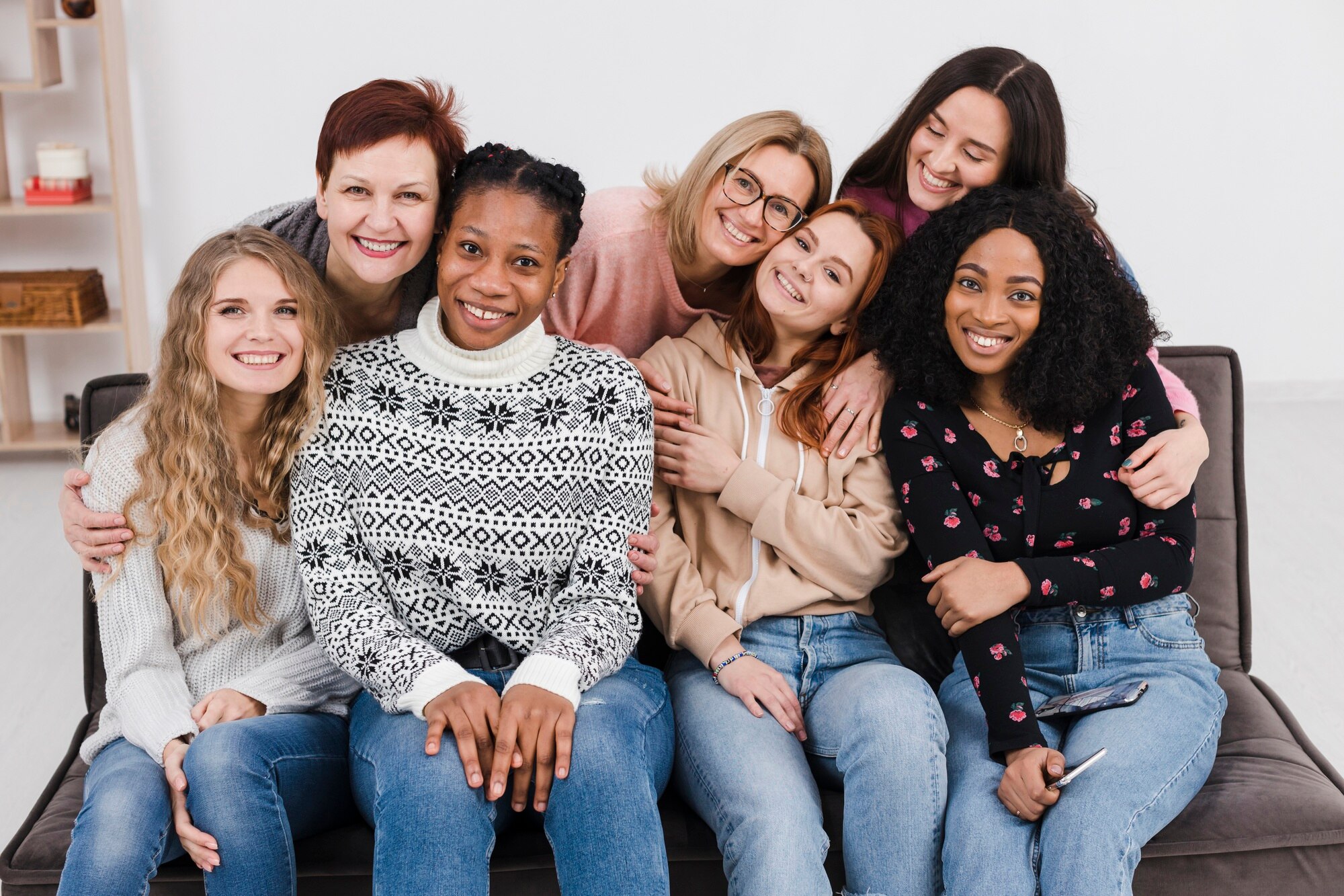 group of women holding each other